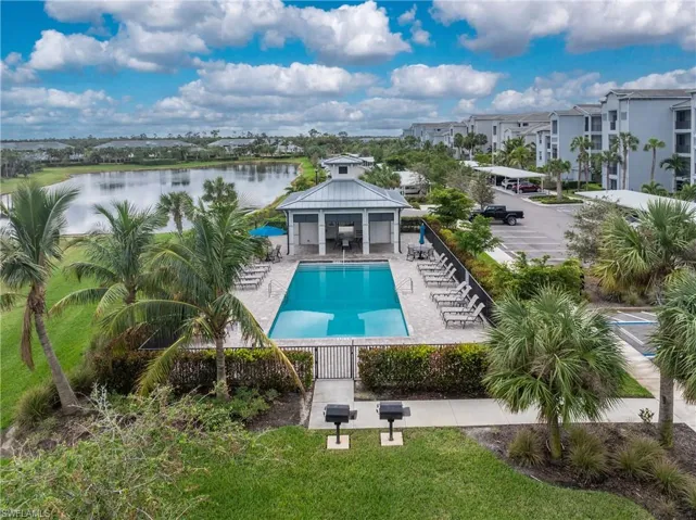 Pool featuring a gazebo, fence, a patio, and a water view