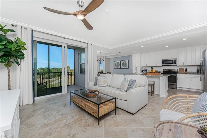Living area with recessed lighting and ceiling fan