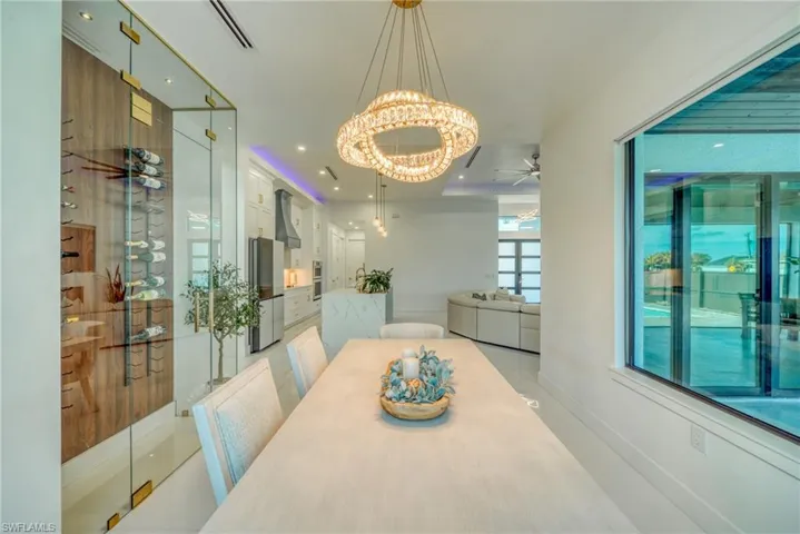 Dining area with ceiling fan and hanging lights