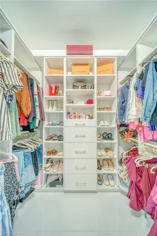 Walk in closet featuring light tile patterned floors