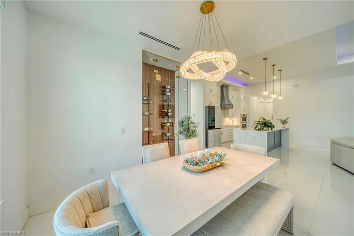 Dining room with suspended lighting and baseboards