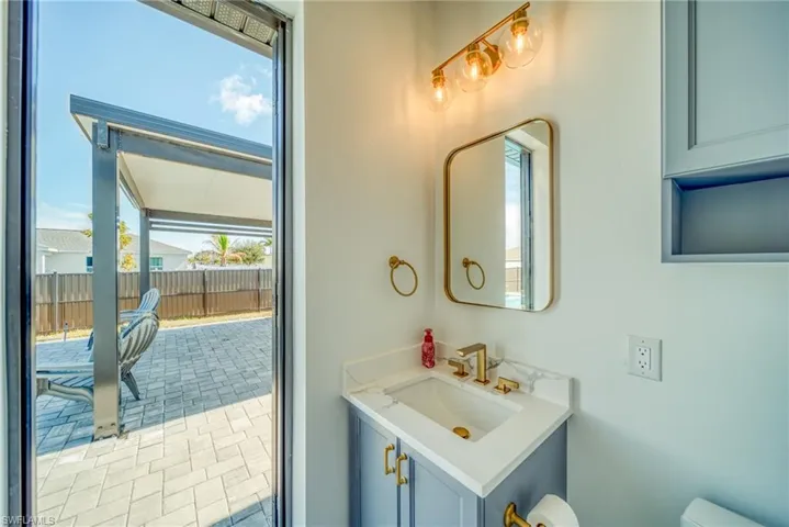 Bathroom featuring vanity and plenty of natural light
