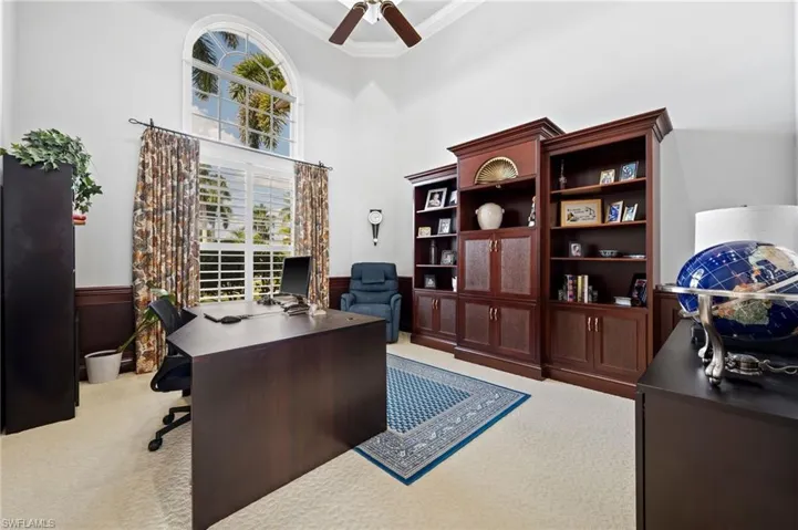 Stunning executive office with soaring ceilings on first level of home