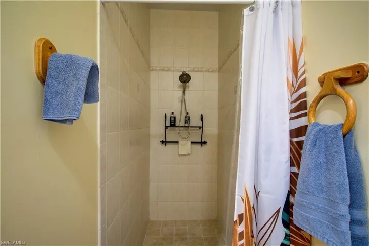 Bathroom featuring a shower stall