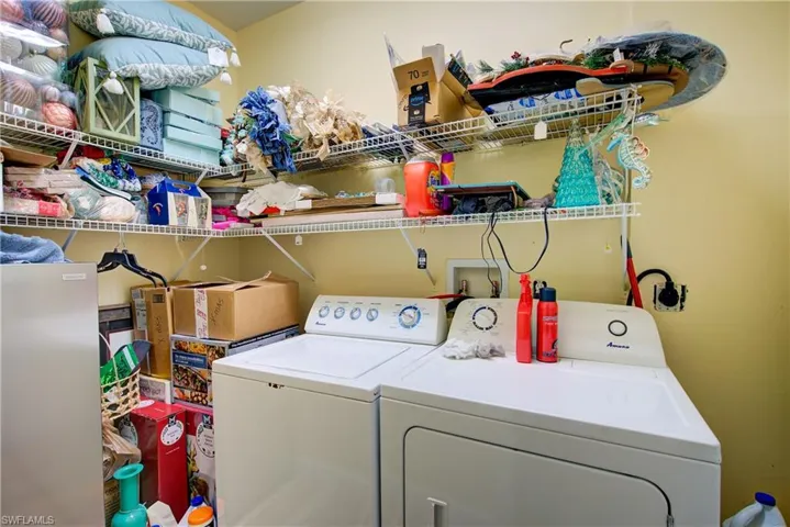 Laundry room featuring independent washer and dryer