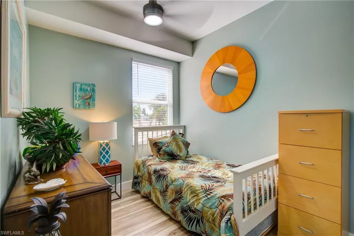 Bedroom featuring light wood finished floors and baseboards