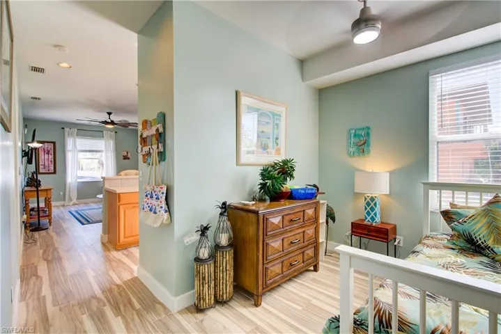 Bedroom with ceiling fan and light wood finished floors