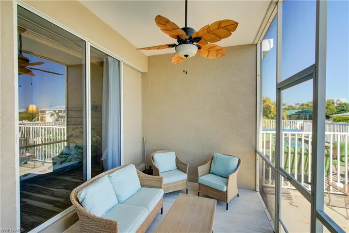 Sunroom with ceiling fan and plenty of natural light