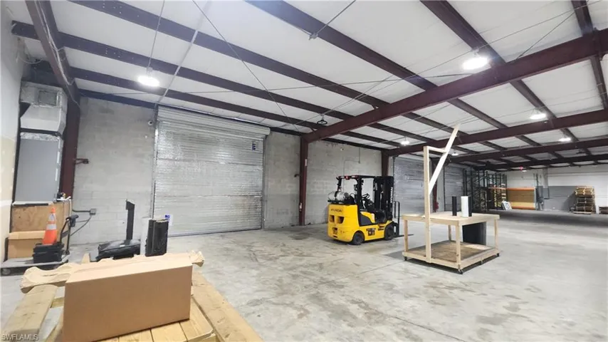 Garage featuring concrete block wall