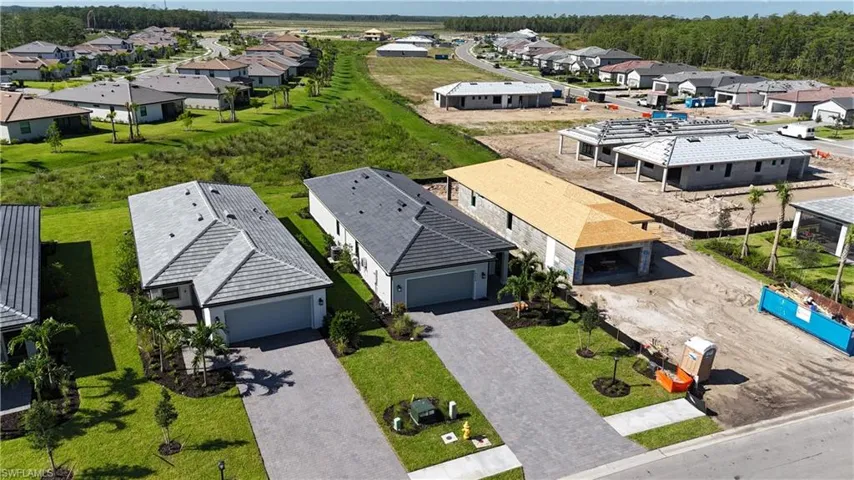 Contemporary single-story residence with a gray tile roof and two-car garage
