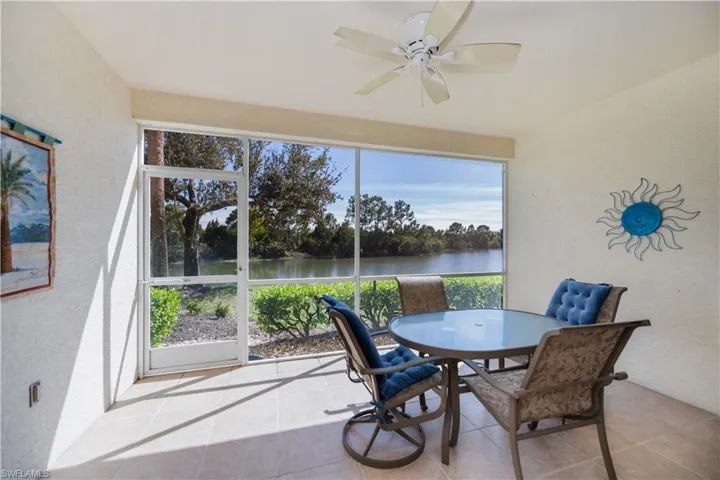 Sunroom featuring a water view
