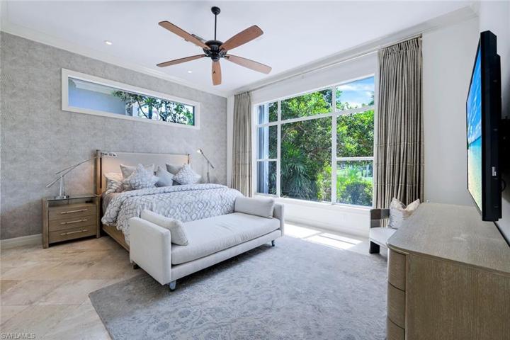 Primary bedroom with golf course views.