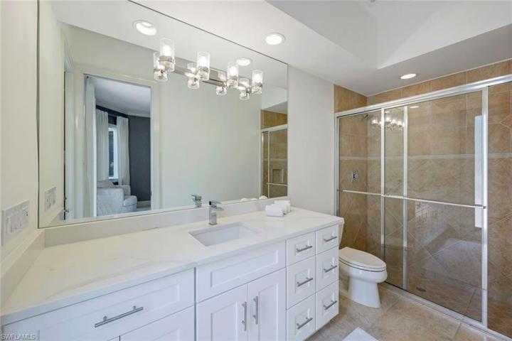 En suite guest bathroom, also with courtyard access.