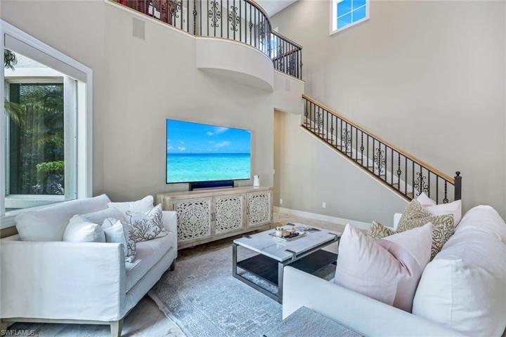 Stunning staircase with wrought iron ballusters.