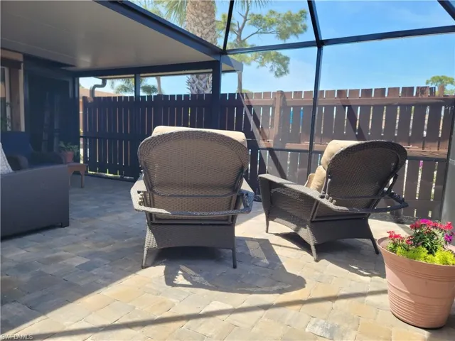 View of patio with a lanai
