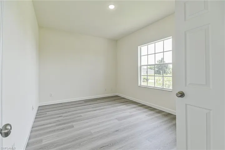 Spare room featuring light wood-style floors and recessed lighting