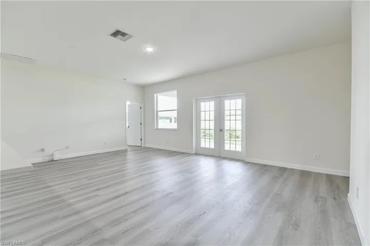 Spare room featuring light wood-style floors and recessed lighting