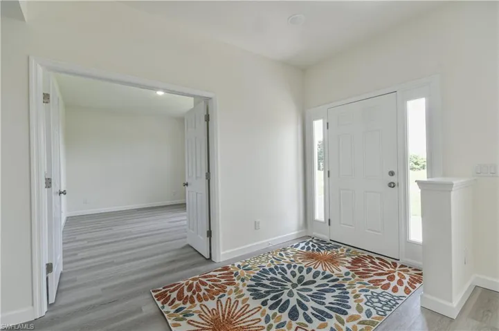 Entryway featuring light wood finished floors and baseboards