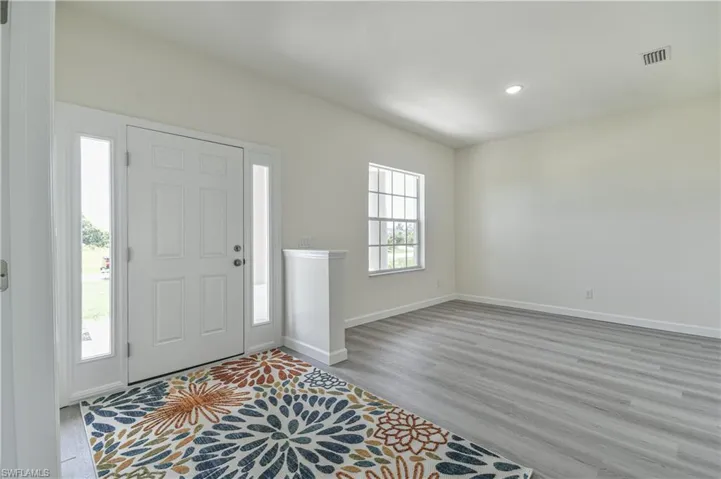 Entrance foyer featuring light wood-style floors and recessed lighting