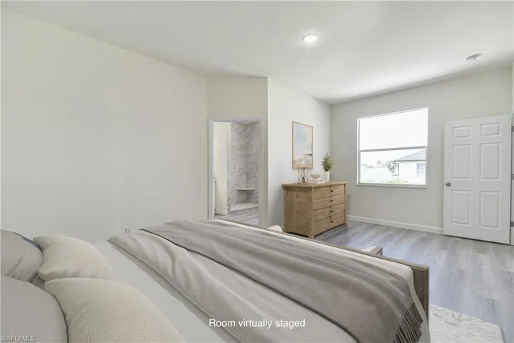 Bedroom featuring light wood finished floors and recessed lighting