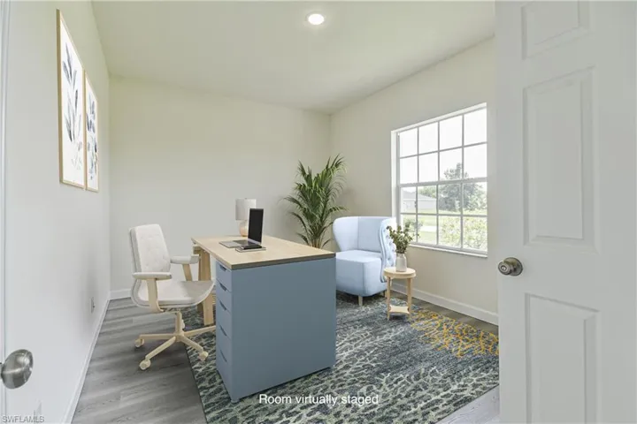 Office space featuring dark wood-style floors and recessed lighting