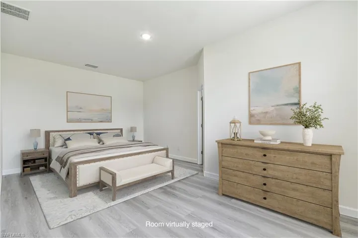 Bedroom featuring baseboards and light wood finished floors