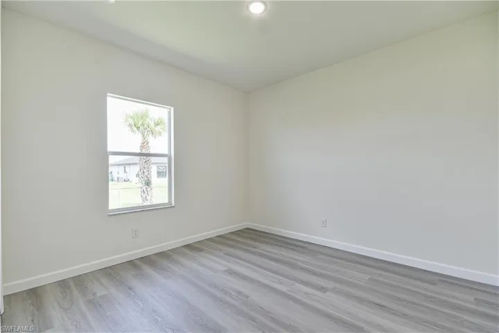 Unfurnished room featuring light wood-type flooring and recessed lighting