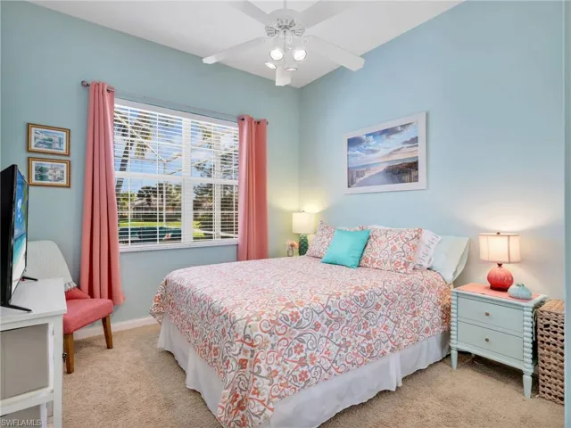 Bedroom featuring light carpet and ceiling fan