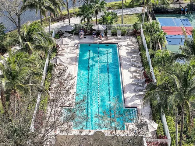 Community pool with a patio