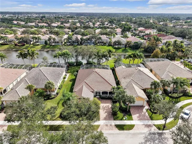 Aerial perspective of suburban area with a large body of water