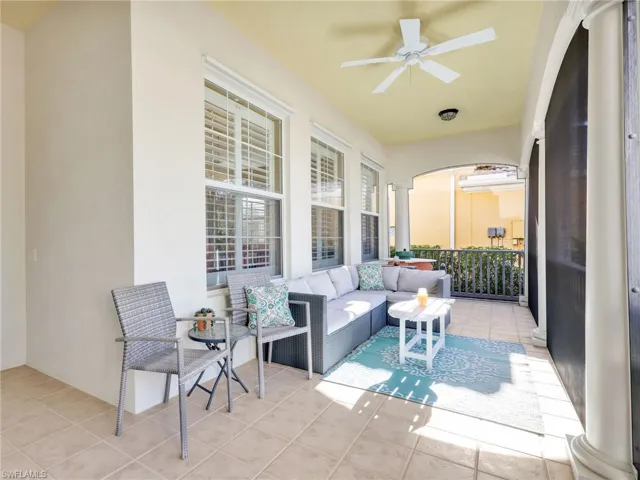 View of patio with ceiling fan and an outdoor hangout area