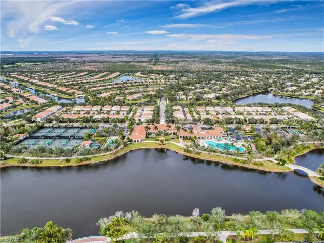 Aerial view of property's location featuring nearby suburban area and a large body of water