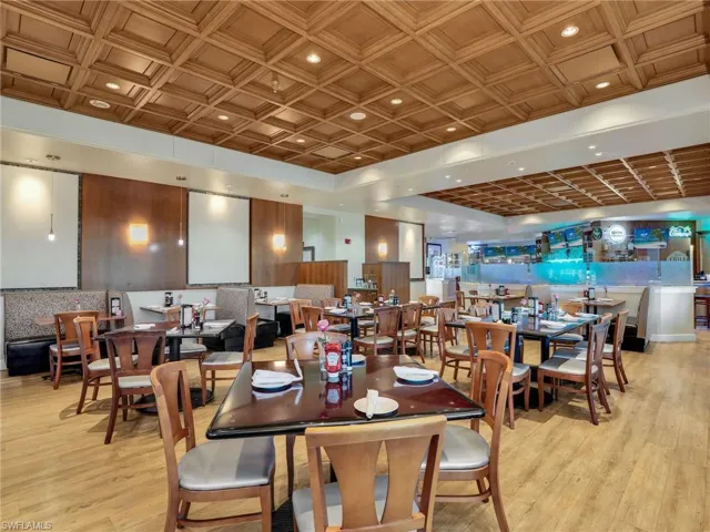 Dining space with light wood-style flooring and recessed lighting