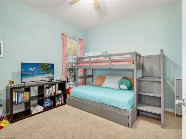Bedroom with carpet flooring and ceiling fan
