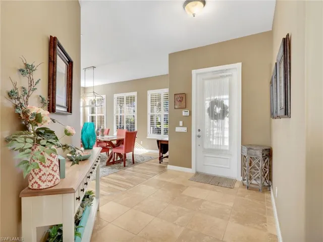 Foyer entrance featuring baseboards