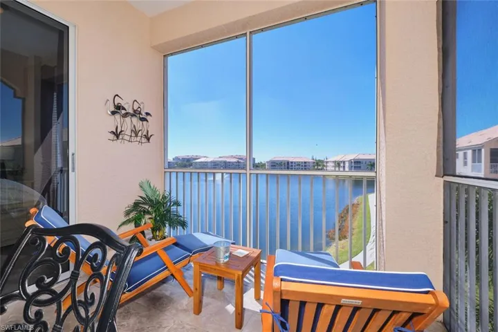 Sunroom with a water view and healthy amount of natural light