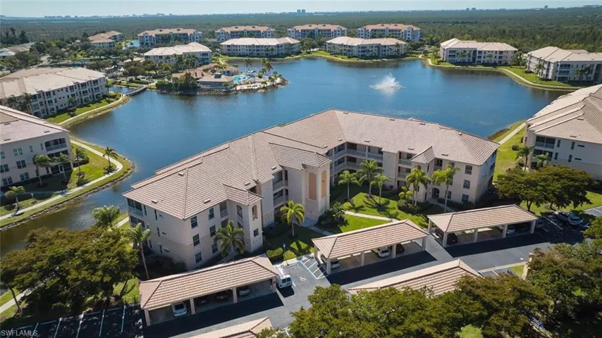 Aerial view of apartment complex / building and a nearby body of water