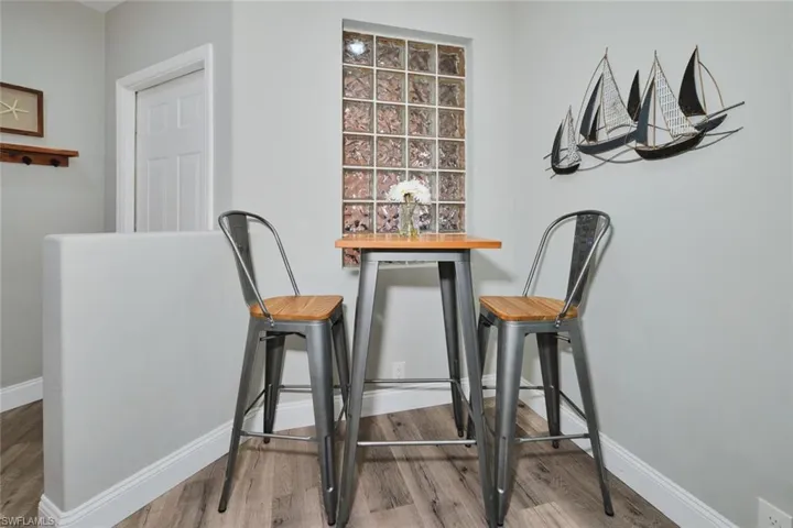Dining room with baseboards and wood finished floors
