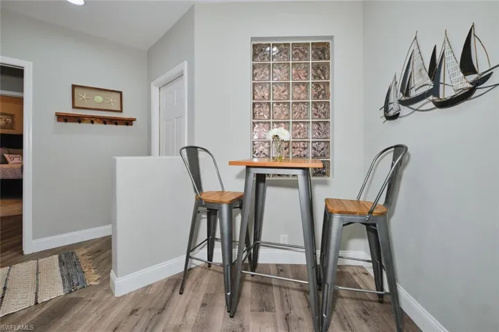 Dining area with baseboards and wood finished floors