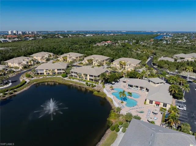 Aerial view of a nearby body of water and a pool