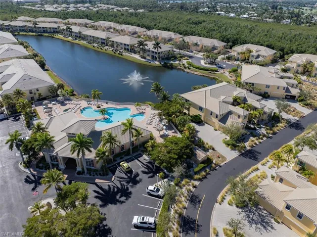 Aerial perspective of suburban area featuring a large body of water