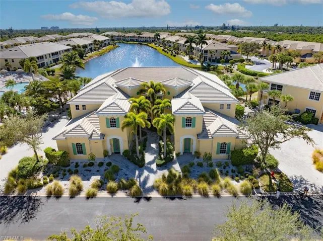 Aerial perspective of suburban area with a nearby body of water