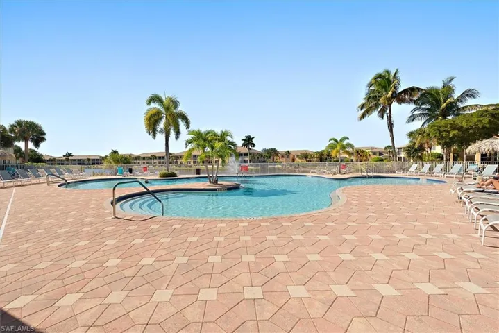 Community pool (1 of 2) featuring a patio area.Pool located within walking distance from home.