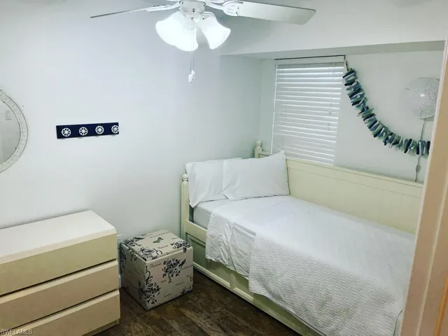 Bedroom featuring dark wood finished floors and ceiling fan