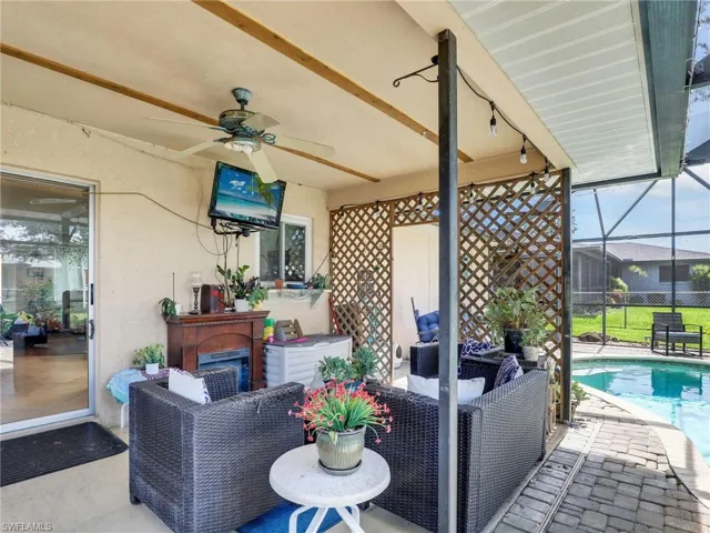 View of terrace with ceiling fan, outdoor lounge area, and a lanai