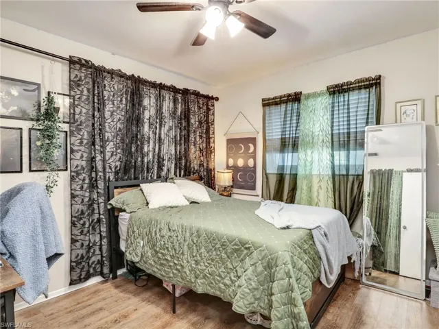 Bedroom featuring hardwood / wood-style floors and ceiling fan