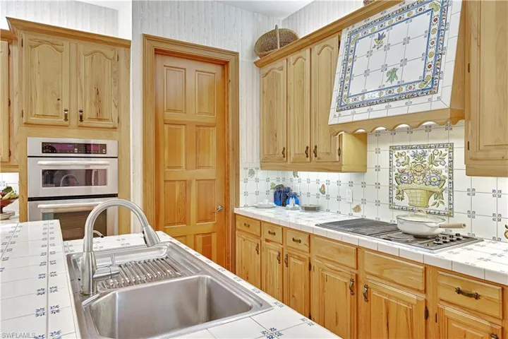 Hickory Wood Cabinetry, SS Sink, Dishwasher, Range, Microwave, Cooktop