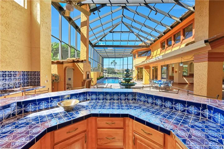 Large, Covered, Tiled Bar Party Area, Wood Cabinetry. Western Rear Exposure