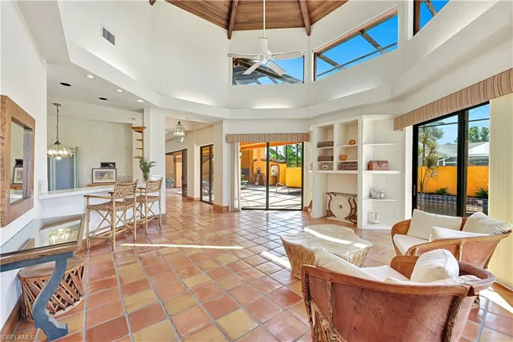 Sunshine, Soaring Ceilings and Tropical Breezes Throughout the Home