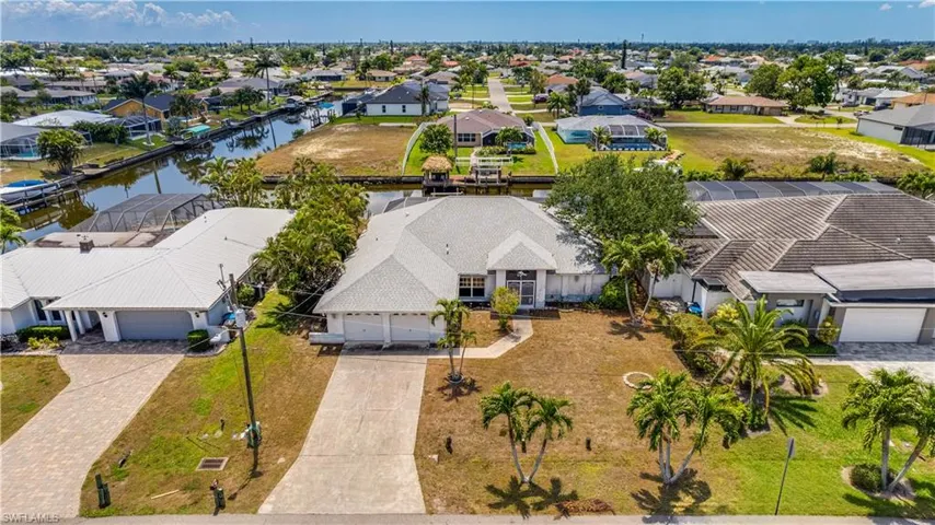 Aerial view of property featuring a water view.